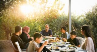 Sharing a family dinner among the olive groves of Jordan